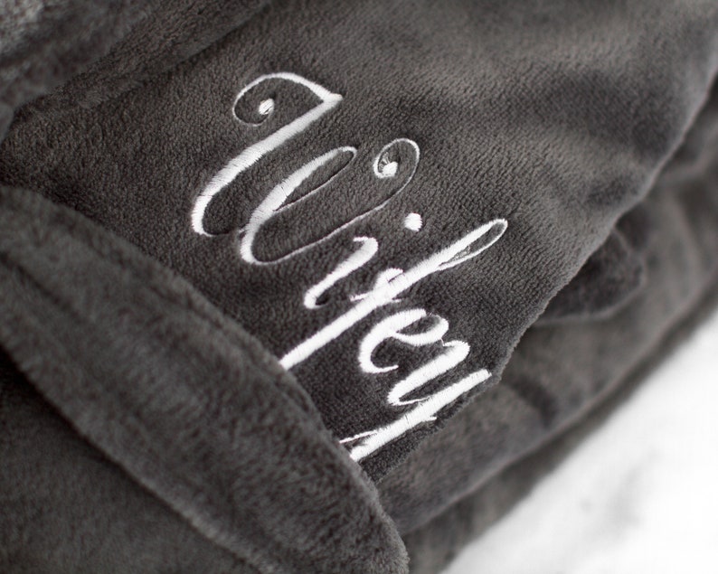 May include: Gray robe with a white embroidered word "wifey" on the front.
