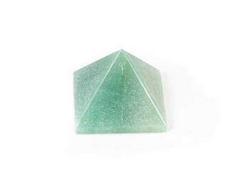 May include: A green crystal pyramid, a popular item for meditation and energy healing.