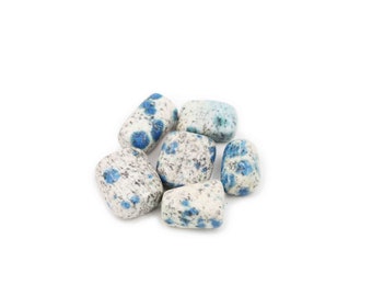 May include: A group of six blue and white speckled stones. The stones are smooth and polished, and they have a natural, organic look.