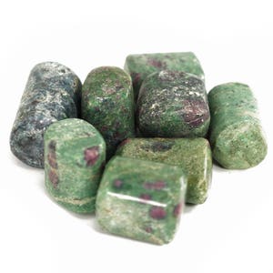 May include: A group of tumbled green and red stones with a speckled pattern. The stones are smooth and polished.