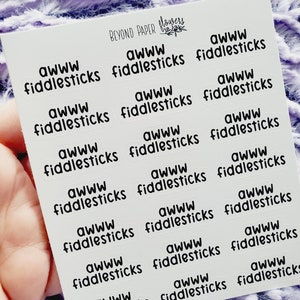 May include: A sheet of white sticker paper with 16 black and white stickers. Each sticker says "awww fiddlesticks".