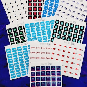 May include: A set of 10 sheets of stickers featuring various streaming service logos. The logos include Netflix, HBO Max, Apple TV, Showtime, Britbox, Vudu, and YouTube TV. The stickers are printed on white paper with a glossy finish.