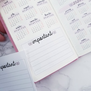May include: A pink and white planner with a monthly calendar for the year 2020. The planner has a section for notes with the word "important" written in black cursive with a pink bow.