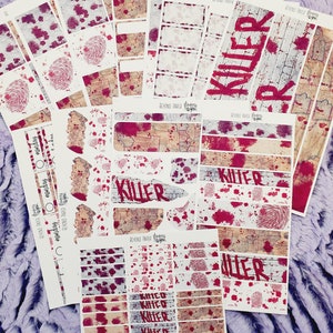 May include: A set of planner stickers with a bloody, grunge aesthetic. The stickers feature the word "Killer" in red spray paint, blood splatters, and fingerprint patterns. The stickers are printed on white paper.