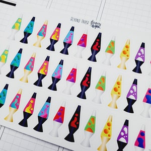 May include: A sheet of colorful lava lamp stickers. The stickers feature various colors and designs, including red, blue, green, yellow, and purple. The stickers are perfect for adding a retro touch to planners, journals, laptops, and other surfaces.