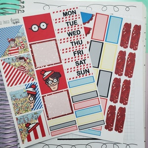 May include: A set of colorful planner stickers featuring a red and white striped pattern, a cartoon character wearing a red and white striped hat, and the days of the week: Monday, Tuesday, Wednesday, Thursday, Friday, Saturday, Sunday.