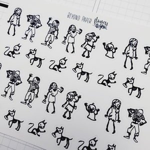May include: Black and white sticker sheet with illustrations of zombies, cats, and a baby. The sheet has the text "Beyond Paper Flowers" on it.