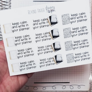 May include: A sheet of planner stickers with the text "keep calm and write in your planner." The stickers feature images of notebooks and dotted patterns. The brand name "BEYOND PAPER flowers" is at the top.