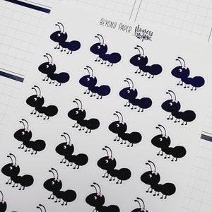 May include: A sheet of black and white ant stickers with pink bows. The stickers say "Beyond Paper Flowers" at the top.