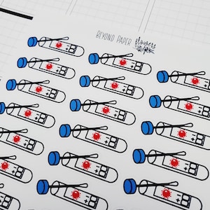 May include: A sheet of stickers featuring multiple illustrations of blue and white COVID-19 test tubes with a red virus symbol and a black and white thermometer reading +88. The stickers are on a white background with the text "BEYOND PAPER flowers" in black.
