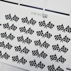 May include: A sheet of black and white checkered flag stickers. The stickers are arranged in a grid pattern on a white background. The text "BEYOND PAPER flowers" is printed in the top center of the sheet.