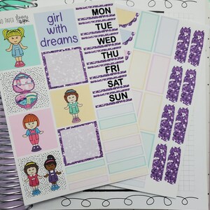 May include: A set of planner stickers featuring a purple glitter design. The stickers include a set of daily boxes with the days of the week, a set of blank boxes, a set of purple glitter shapes, and a set of stickers with illustrations of girls and the text "girl with dreams".