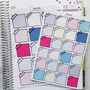 May include: Two sheets of colorful square stickers with a black outline and a white ribbon design. The stickers are labeled "beyond paper flowers".