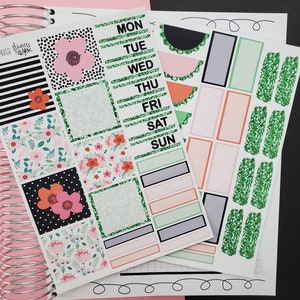 May include: Planner stickers with floral and geometric patterns, including black and white stripes, polka dots, and flowers in pink and orange. The stickers include labels for each day of the week, and decorative elements with green glitter.