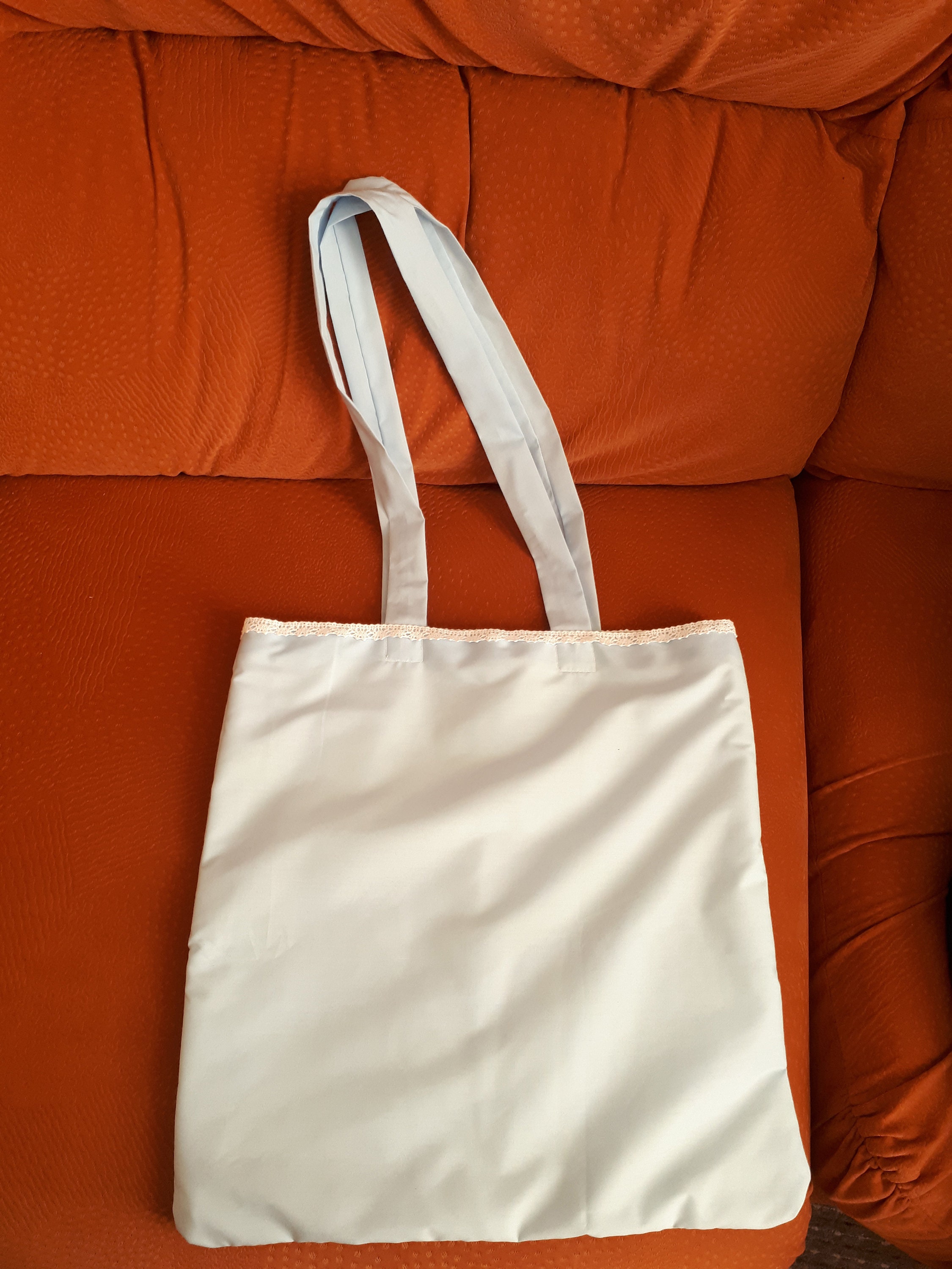 white luggage with tan trim