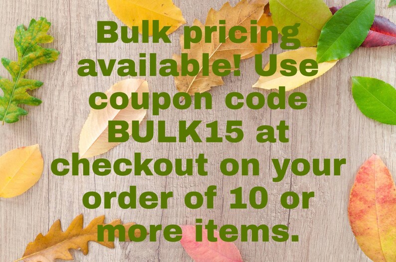 May include: A light brown wood-grain background decorated with scattered autumn leaves in shades of yellow, orange, green, and red. The text in dark green reads: Bulk pricing available! Use coupon code BULK15 at checkout on your order of 10 or more items.