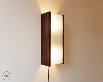 Wall lamp light ( sconce ) from walnut or sapele and organic glass.