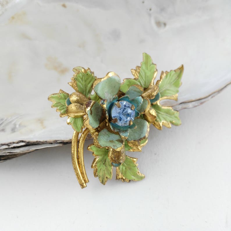 small blue brooch