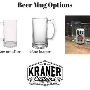 May include: Two clear glass beer mugs, one 16 ounce and one 26 ounce, with a can of Lite beer in the background. The mugs are both standard style with a handle on the side.