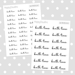 May include: A sheet of black and white stickers with the text "bath time" repeated multiple times. The stickers are designed for use in a planner or journal.