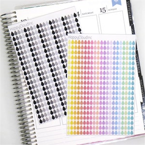 May include: Two sheets of colourful raindrop stickers. The first sheet has black and grey raindrops. The second sheet has a rainbow of colours, including yellow, orange, pink, red, purple, blue, and green.