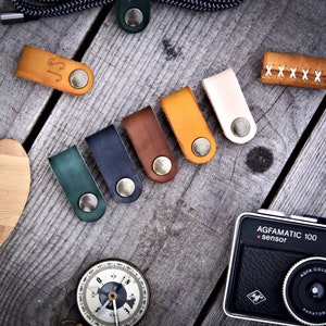 Custom leather cable organizer. Cord holder, cable wrap, and headphone holder. Customizable, full-grain leather.