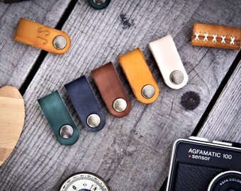 Custom leather cable organizer. Cord holder, cable wrap, and headphone holder. Customizable, full-grain leather.