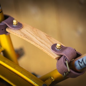 Bike carrying handle. Full-grain vegtanned leather and wood handle.