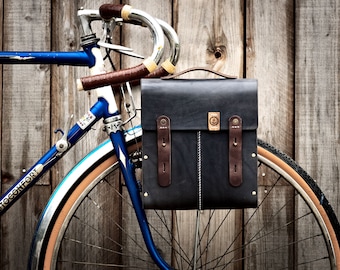 Flight bag , cycle bag, bicycle bag. Vegtanned leather , wood, Adjustable Webbing Shoulder Strap and brass hardware.