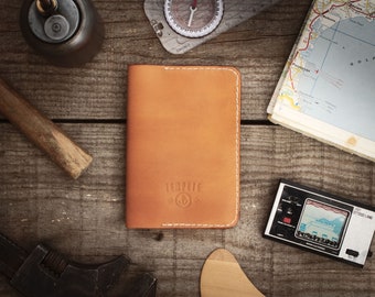 Leather passport holder, honey-colored leather passport cover.