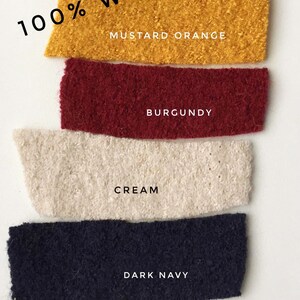 May include: Four fabric swatches of 100% wool in different colors: mustard orange, burgundy, cream, and dark navy.