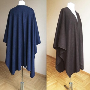 May include: Two wool ponchos, one navy blue and one brown, displayed on mannequins. The ponchos are draped over the mannequins and have a simple, elegant design.