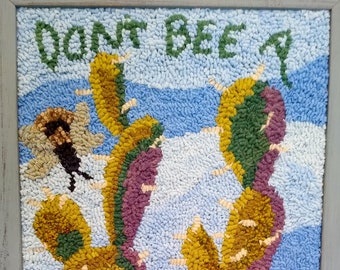 Don't Bee a Prick, hooked wool wall hanging by Gail Cleveland