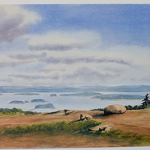 May include: A watercolor painting of a scenic landscape with a view of a body of water and islands in the distance. The foreground features a rocky outcropping with a large, round boulder and a few small trees. The sky is a light blue with fluffy white clouds.