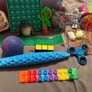 Fidget toys, fidget, fidget box, mystery fidget box, desk toys, squishy toys, squishes, mystery, mystery box, mystery fidget box, fidgets,