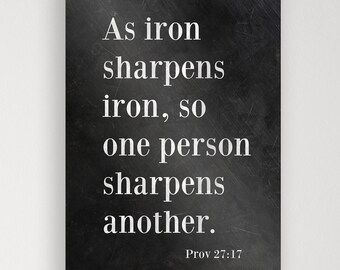 May include: Black and white typography print with the quote "As iron sharpens iron, so one person sharpens another." and the scripture reference "Prov 27:17".