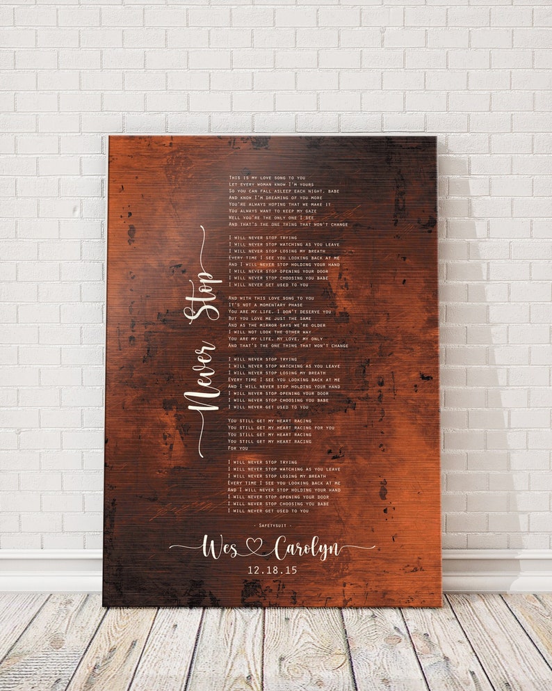 May include: A rustic wood-grain background with a white text overlay of a song titled "Never Stop". The lyrics are a love song with the names "Wes" and "Carolyn" and the date "12.18.15" at the bottom.