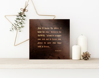 May include: A rustic brown canvas print with a gold metallic quote from Jeremiah 29:11. The quote reads "For I know the plans I have for you," declares the LORD, "plans to prosper you and not to harm you, plans to give you hope and a future."