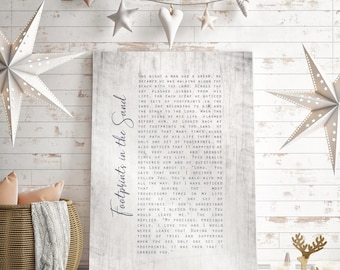 May include: A white canvas print with a blue text overlay. The text is a story about footprints in the sand and a man's journey with God. The text reads, "One night a man had a dream..."