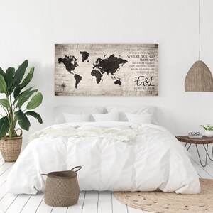 May include: A wood sign with a black world map and the text "Don't face me to leave you or turn back from me. Where you go I will go and where you stay I will stay. Your people will be my people and your God my God." with the initials "E&L" and the date "June 15, 2019".