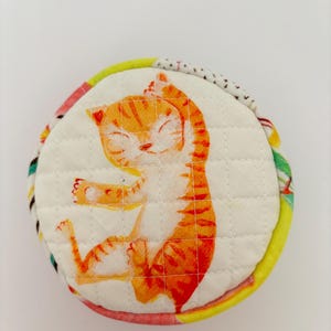 Handmade, round, cotton, Heather Ross by Hand fabric, cat, quilted, lined zipper pouch.