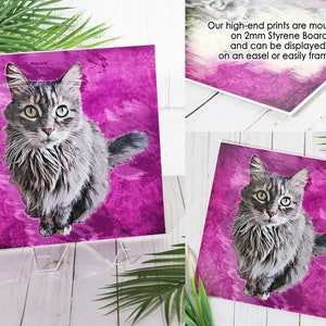 May include: A gray and white cat with green eyes sits on a pink background with a watercolor effect. The image is printed on a 2mm styrene board and can be displayed on an easel or framed.