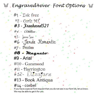 May include: A list of font options for engraving, with a butterfly graphic at the top and bottom of the list. The font names are listed with numbers, starting with #1 Ink free and ending with #14 corbel. The text at the bottom of the list reads: "If you have a special Font request that you do not see in our font list, let us know. We may be able to get it for you."
