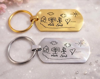 Kinder, die Kunst Keychain zeichnen. Kinder gezeichnete Skizze Keychain. Einzigartiges Geschenk von Kind oder Kindern, die zeichnen oder schreiben. Replik von Kinderzeichnungen.