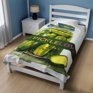 May include: White bedspread featuring a watercolour illustration of a jar of pickles. The jar is labelled "Pickle Love" in green and pink lettering.