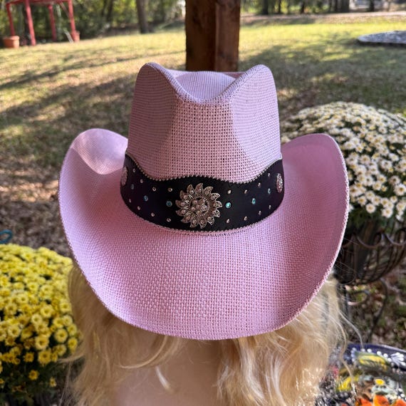 Pink Western Cowboy Hat Featuring a Black Hat Band Adorned 