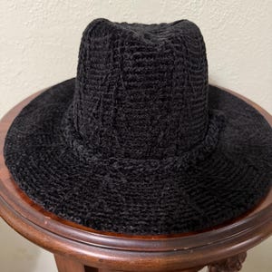 Black Chanel Look Fedora with a Braided Hat Band. Great look with Formal to Casual Attire. One Size Fits Most with Adjustable Band