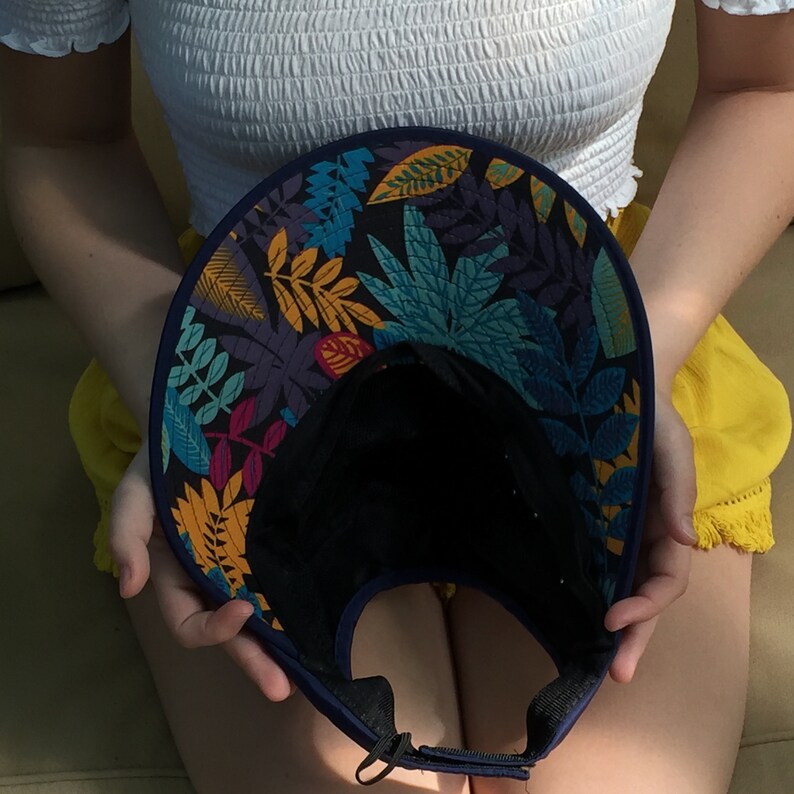 Blue Visor Foldable Hat with Pretty White Flowers Rhinestones and Studs Monogrammed with Messy Bun /& Too Much Sun