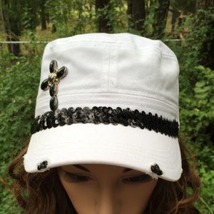 Flat Top Cap with a Vintage Look in White with a Black Sequin Hat Band and a Black and Silver Cross