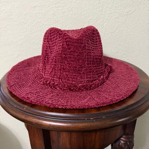 Red Burgundy Chanel Look Fedora with a Braided Hat Band. Great look with Formal to Casual Attire. One Size Fits Most with Adjustable Band